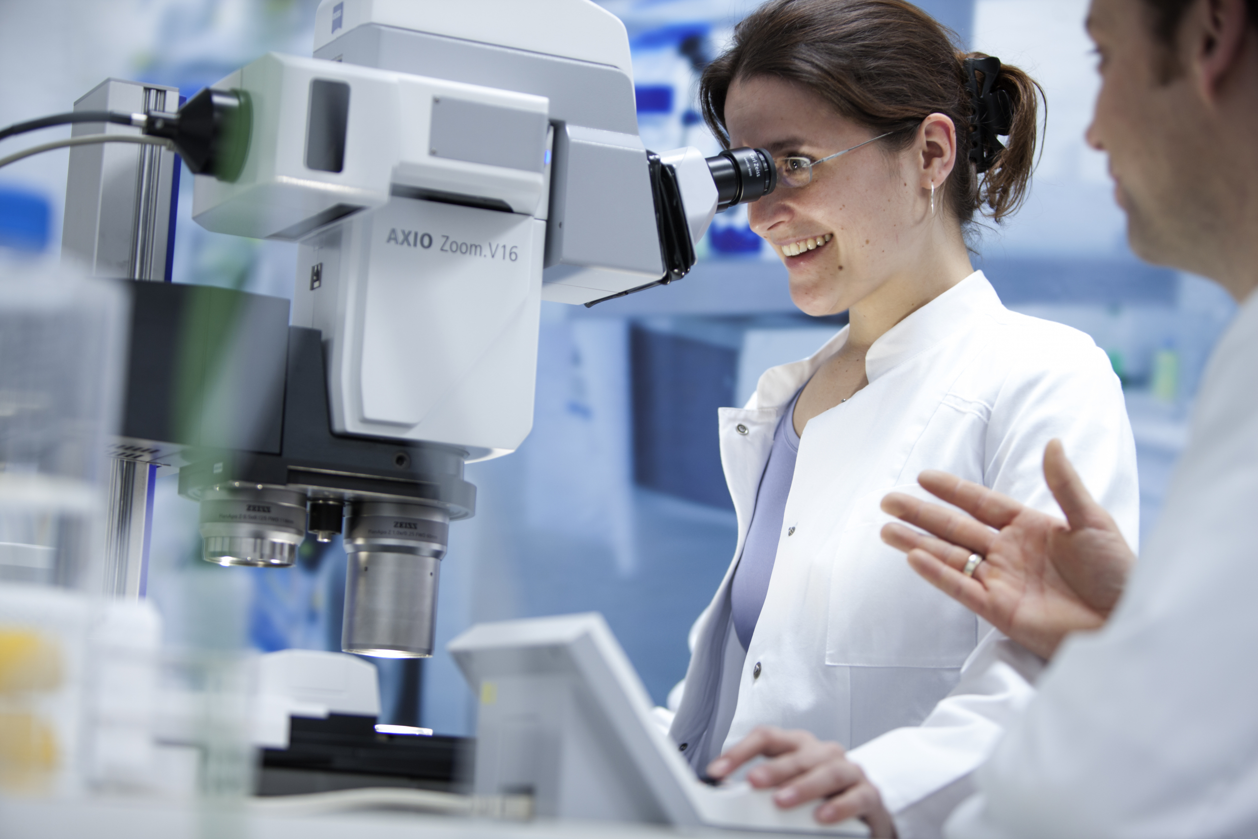 Scientist using Axio Zoom V16 microscope in a lab