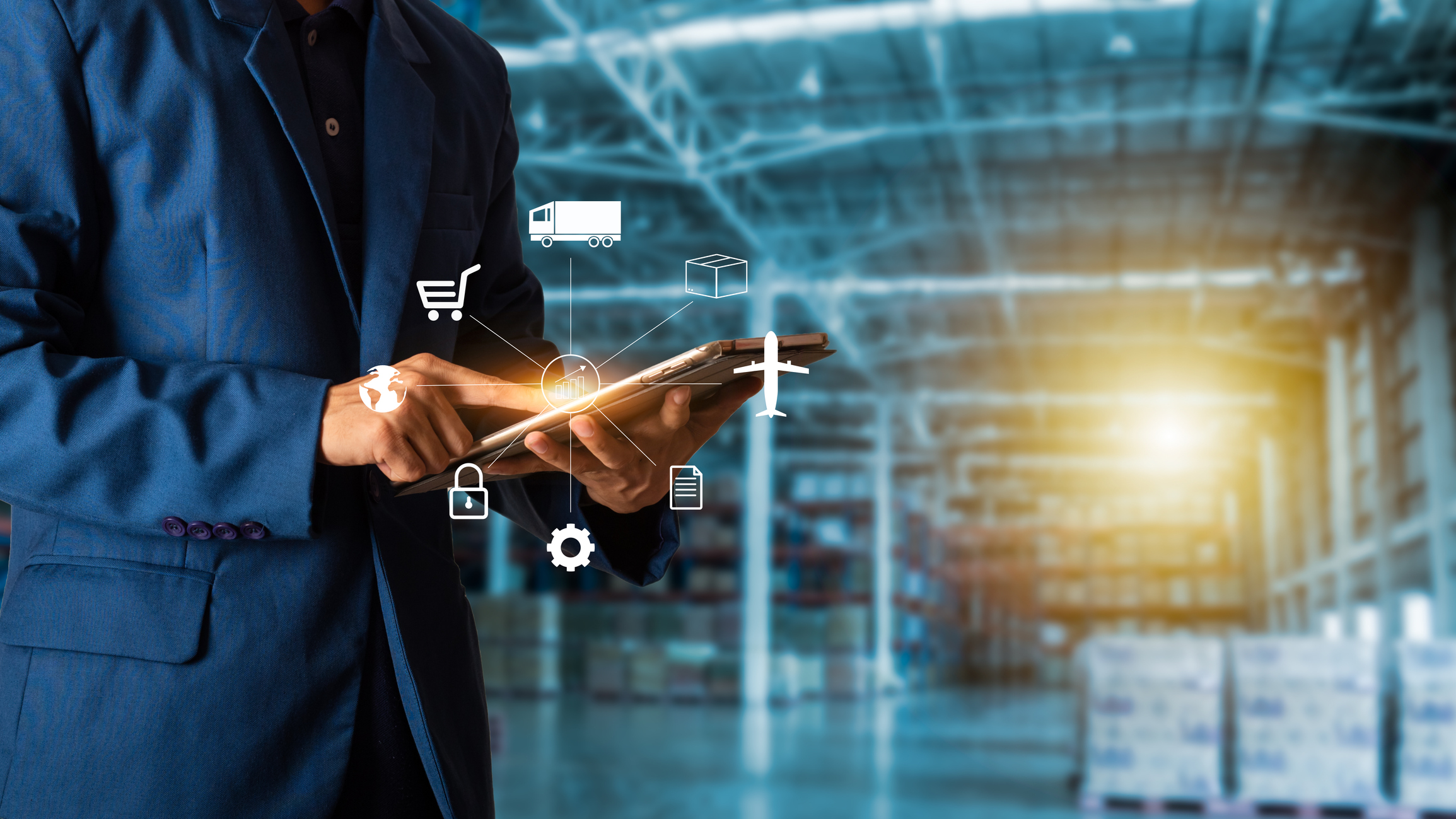 person using tablet in warehouse with shipping and document icons