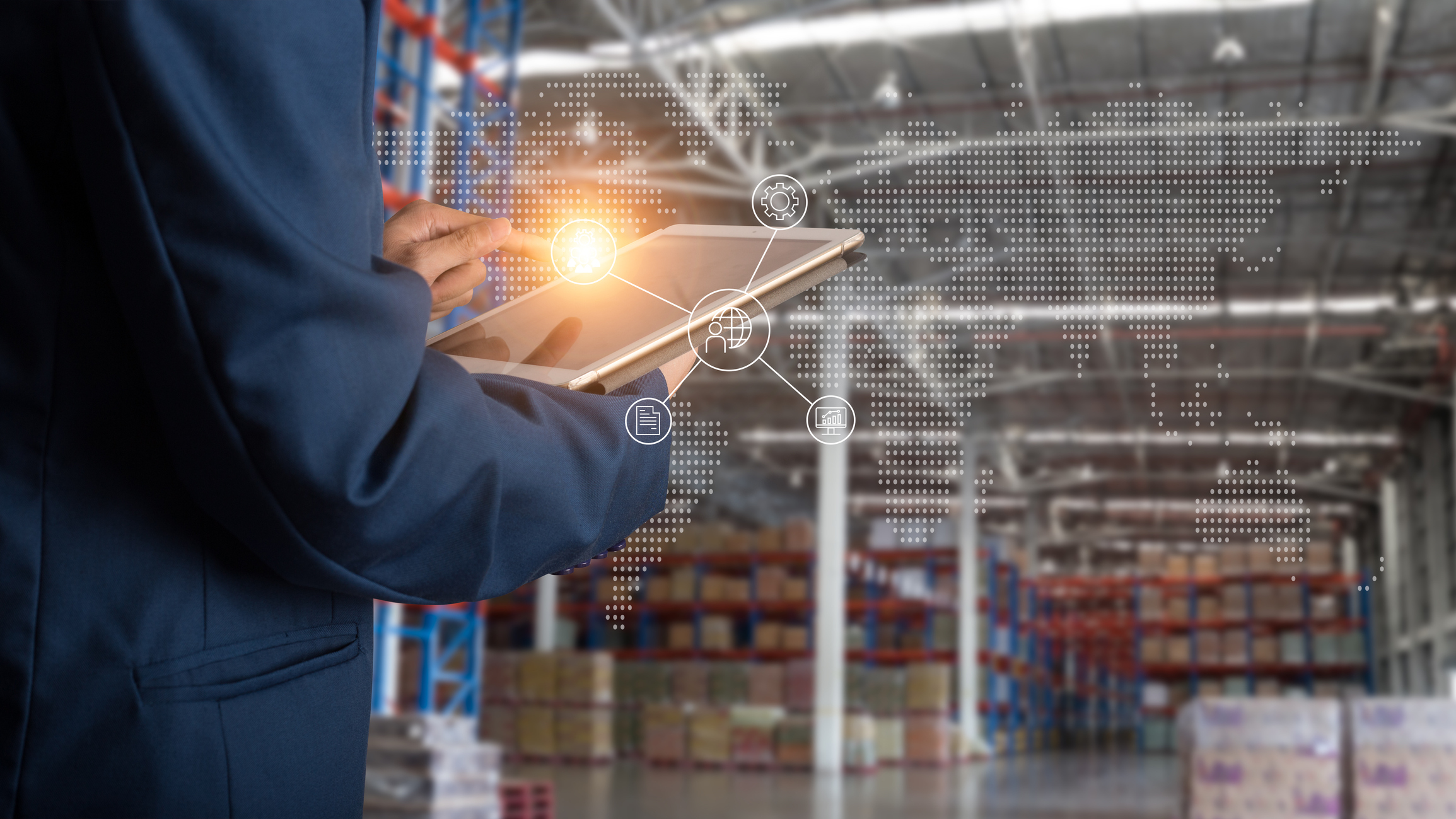 person in warehouse with tablet